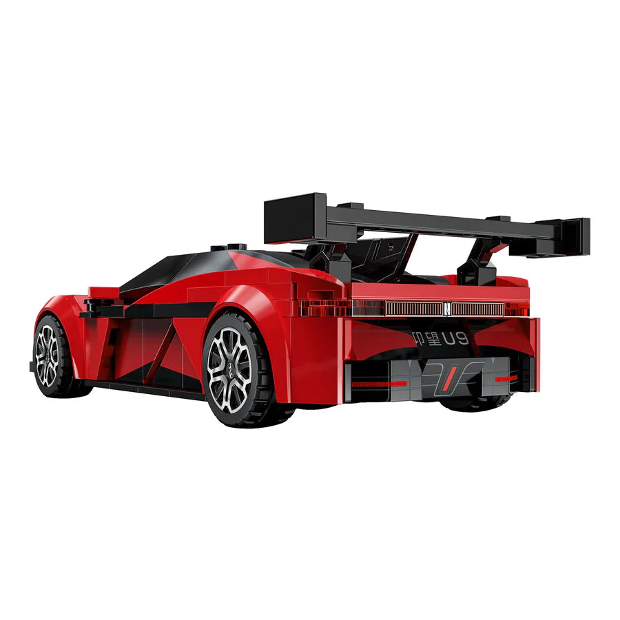 Red toy race car with black accents on a white background