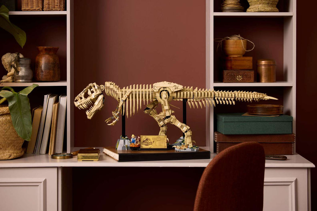Impressive LEGO Jurassic Park T-Rex dinosaur fossil skeleton model, tan bricks on a black display stand. Bricking Lebanon