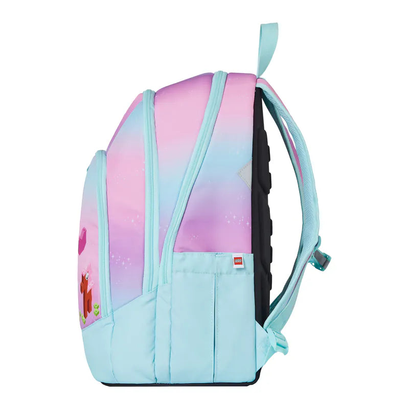 Backpack with a gradient design transitioning from pink to blue on a white background