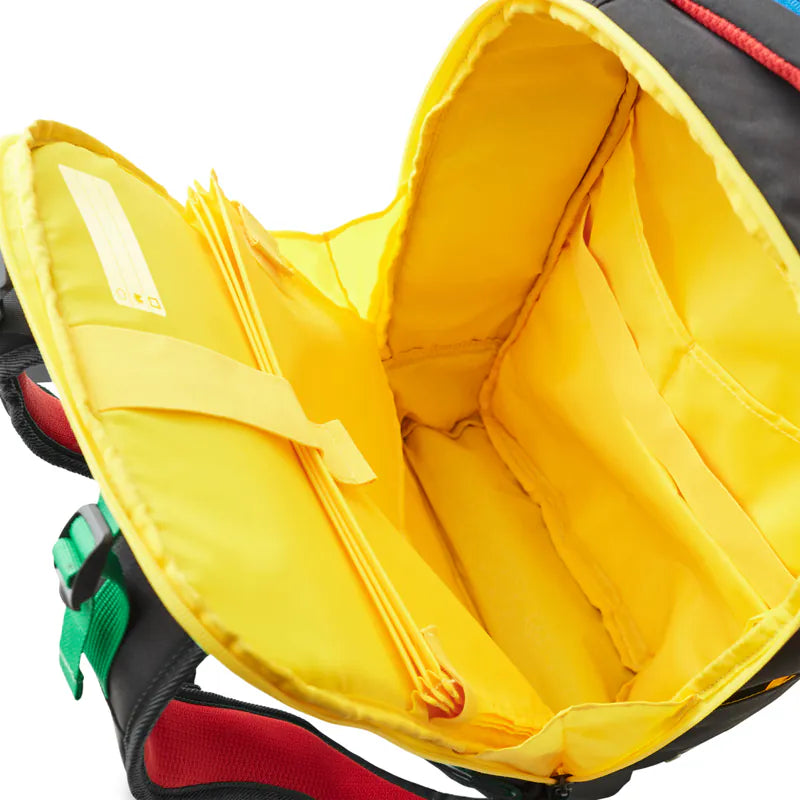 Close-up of a yellow interior of a LEGO Backpack with visible stitching details.