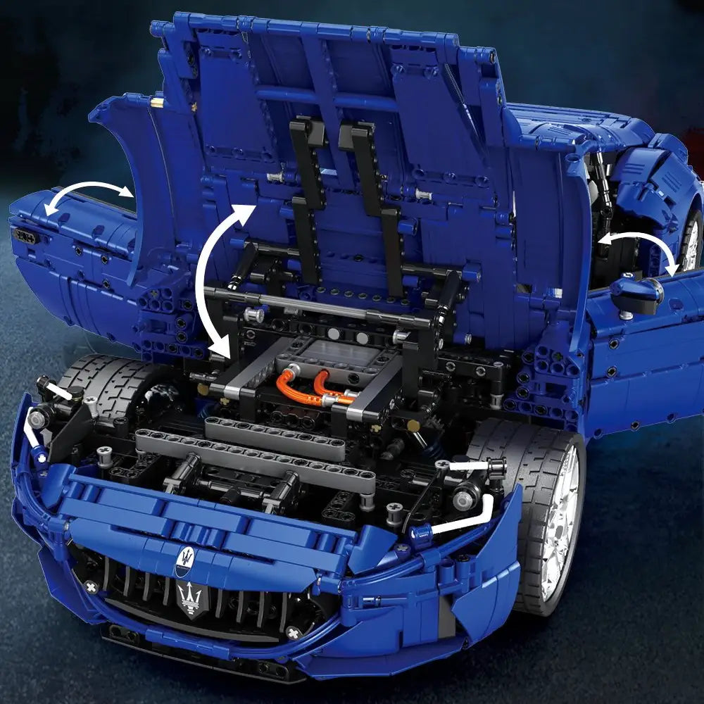 Blue toy car model with open hood on a dark background