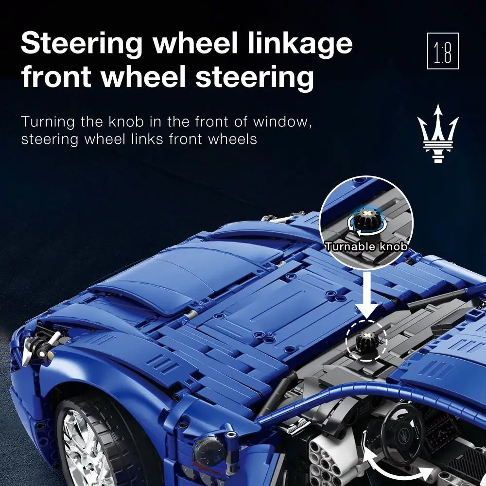 Blue model car with steering wheel linkage mechanism and Maserati logo.